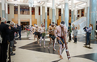 thumbnail image: Welcome to Country ceremony performers leave the Great Hall
